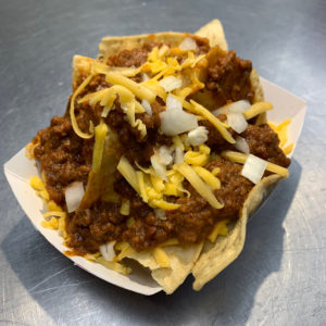 Chili piled onto corn chips